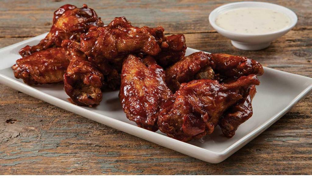 Bone In Wings · One pound of Bone-In Chicken Wings.  Crispy on the outside, plump and juicy on the inside. Our Wings are tossed in your favorite sauce and served with your choice of dipper.