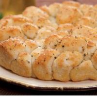 Italian Monkey Bread · Bite-size pieces of dough-oven baked to soft, chewy perfection, brushed with a garlic butter...