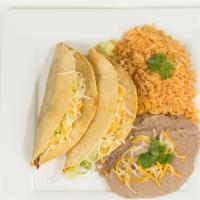 #2 - Two Beef Or Chicken Tacos · 2 Shredded Beef, Chicken, or Ground Beef Tacos. Hard shell Tacos with Lettuce & Cheese.