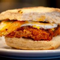 Hot Chicken Biscuit · Fresh baked biscuit, hot chicken, melted Cheddar, over medium egg and bacon. Drizzled with h...