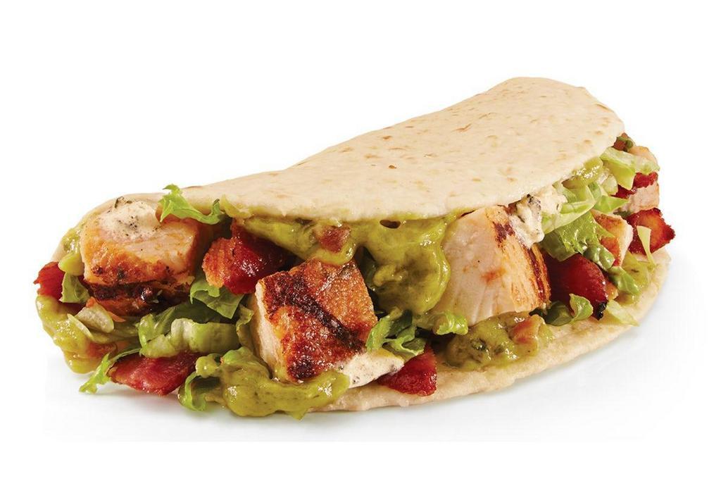 Chicken Bacon Guac Street Taco · Our Chicken Bacon Guac Street Taco is filled with all-white meat chicken, bacon, guacamole, chimichurri sour cream, and shredded lettuce.