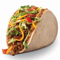 Taco Bravo® · A warm Flour Tortilla smothered in Refried Beans wrapped around a Crispy Corn Shell filled w...