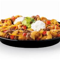 Super Potato Olés® · Signature Potato Olés® topped with our delicious Seasoned Ground Beef, Refried Beans, Nacho ...