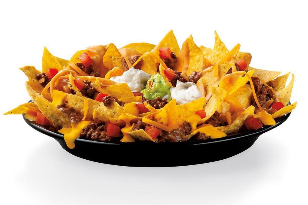 Super Nachos · Freshly fried Tortilla Chips, covered in Nacho Cheese, your choice of protein, Refried Beans, Cheddar Cheese, Diced Tomatoes, Sour Cream and Guacamole.
