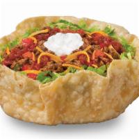 Taco Salad · A fresh Crunchy Tortilla Bowl with Crisp Lettuce, topped with Cheddar Cheese, our signature ...