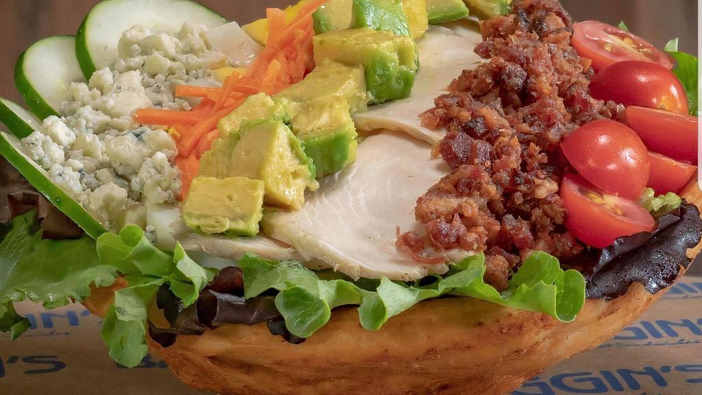 Gourmet Cobb · Mixed greens, carved chicken breast, bacon, Blue cheese, carrots, tomatoes, sliced egg, cucumbers, avocados and house-made honey mustard dressing.