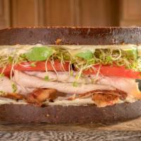 Unforgettable Sandwich · Roasted turkey breast, cream cheese, mayo, crisp bacon, sprouts, tomatoes and avocado on 12 ...