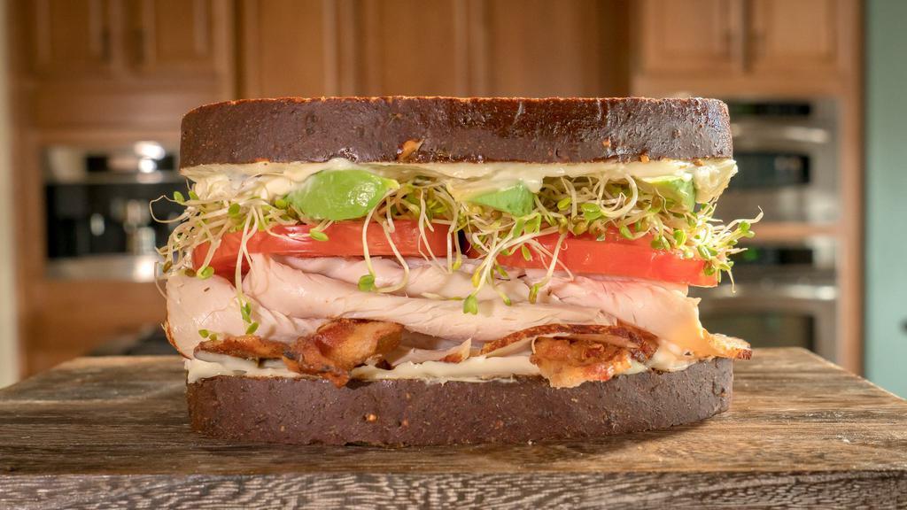 Unforgettable Sandwich · Roasted turkey breast, cream cheese, mayo, crisp bacon, sprouts, tomatoes and avocado on 12 grain bread.