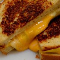 Gourmet Grilled Cheese Sandwich · Delicious Cheddar, Provolone and American cheese with gourmet sauce on Parmesan crusted sour...
