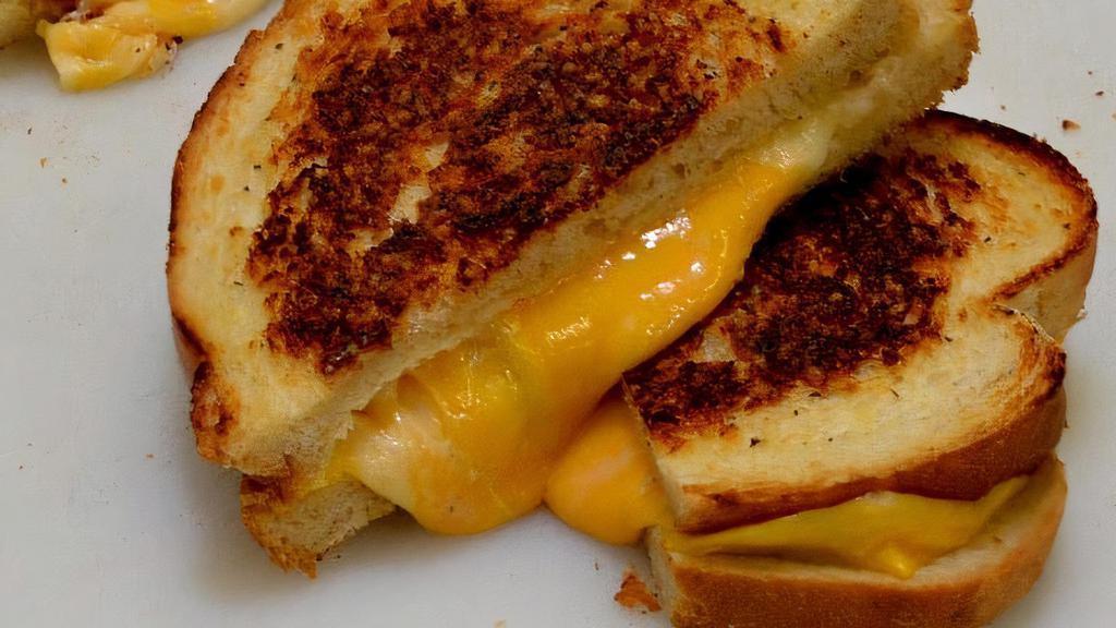 Gourmet Grilled Cheese Sandwich · Delicious Cheddar, Provolone and American cheese with gourmet sauce on Parmesan crusted sourdough.