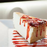 Ricotta Cheesecake · Housemade cheesecake drizzled with strawberry preserves