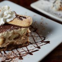 Tiramisu · Lady fingers dipped in coffee layered with mascarpone cheese with chocolate sauce on the side