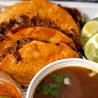Beef Quesabirrias (Order Of 3) · Birria meat folded on crispy corn tortilla with cheese, onions, and cilantro. Served with 8 ...