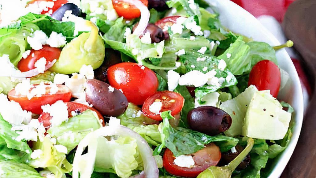 Greek (Large) · Romaine lettuce, red cabbage, cucumbers, red onions, black olives, tomatoes, feta cheese, pepperoncini.