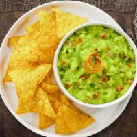 Guacamole & Chips · A heaping scoop of fresh guacamole and warm tortilla chips