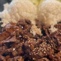 Teriyaki Beef · Thin sliced beef marinated and cooked in sauce. Served with steamed rice and salad.