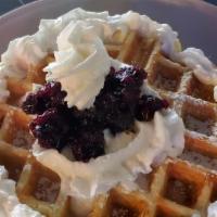 Blueberry Waffle · Fresh hot Belgian waffle topped with blueberry compote, powdered sugar & whipped cream, side...