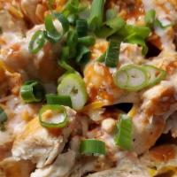  The Buff Chick Notchos · Corn Tortilla chips with our cerveza queso, grilled chicken, buffalo sauce, green onions & c...