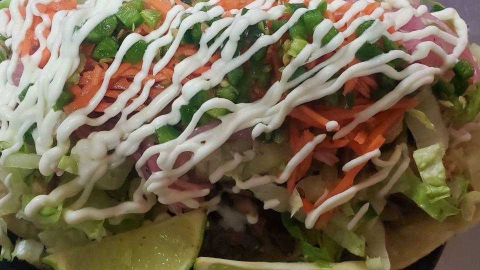 Holy Taco Trinity · Gluten free. Three to an order..Choice of….. Slow braised Carnitas,  Shredded beef or Grilled Chicken, with pickled carrots & red onions, shredded lettuce,  jalapeños, creme fraiche & lime wedges…