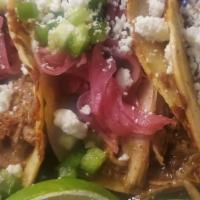 Asian Persuasion Tacos · Slow braised ginger and soy sauce shredded beef with pickled ginger and carrots, green onion...