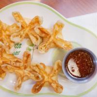 Crab Delight · Crab meat and cream cheese in wonton wrapper, deep-fried and served With plum sauce.