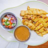 Chicken Satay · Four skewers per order. Grilled marinated chicken breast in yellow curry and coconut milk, s...