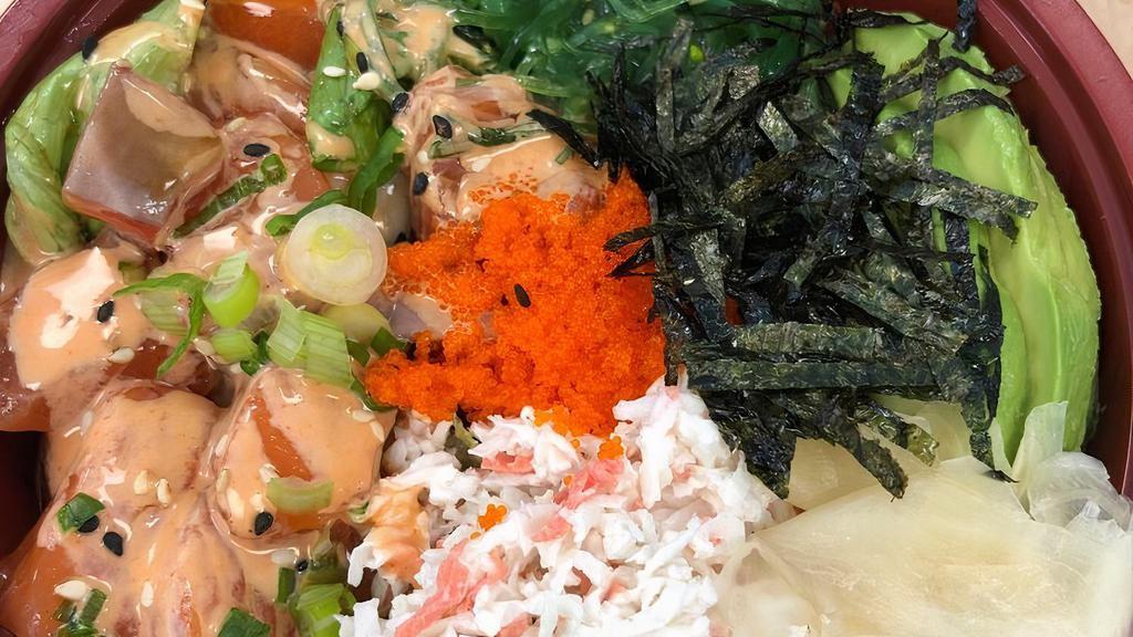 Poke Bowl · Rice and salad served with choice of fresh fish, seaweed salad, shredded kani, tomatoes, cucumber,  avocado, ginger and topped with homemade ginger ponzu sauce and massago.