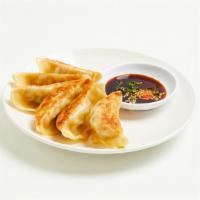 Gyoza · Fried dumplings with pork and vegetable, served with a gyoza dipping sauce.