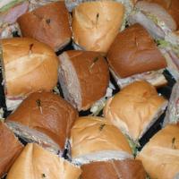 Large Sub Tray Premium · Choose any 4 subs with mayo, mustard, lettuce, tomatoes, and light house dressing. 20 servin...