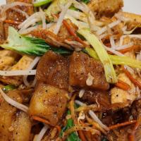 Vegan Stir Fried Rice Noodle · Pan fried rice noodle, tofu, bok choy, carrots, yellow & green onion, bean sprouts stir frie...