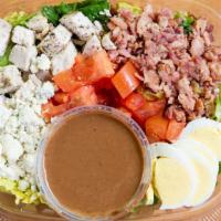 Cobb · Grilled chicken breast, bacon, sliced tomatoes, hardboiled eggs, blue cheese crumbles, romai...