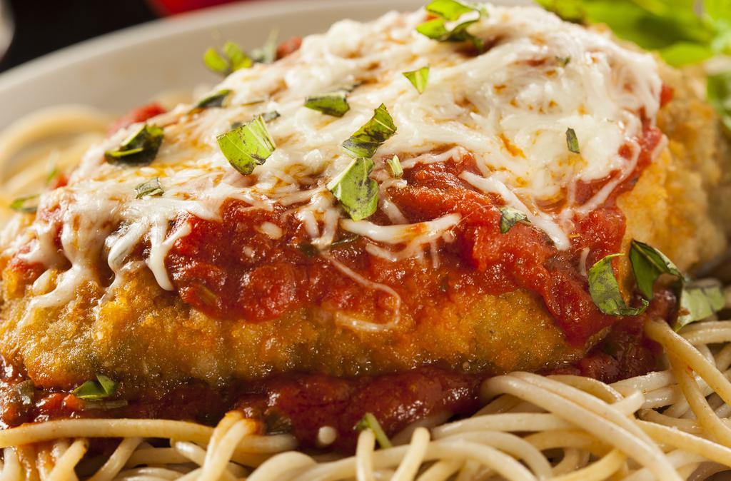 Chicken Parmesan · Breaded & fried chicken breast, house-made marinara, melted mozzarella, served with a side linguine & marinara sauce.