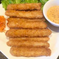 Crispy Fried Calamari (10 Strips) · Crispy calamari served with housemade aioli