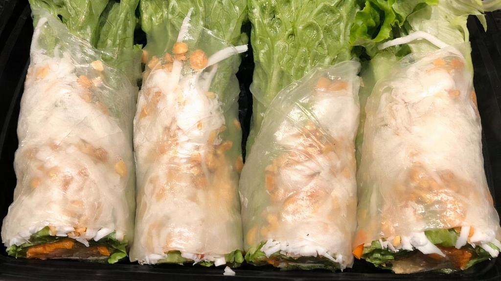 Coconut Summer Rolls · Shredded coconut, toasted peanuts, lettuce, sauteed tofu, stir fried carrots, jicama, basil, crispy rice paper roll wrapped in rice paper, served with a side of homemade peanut sauce.