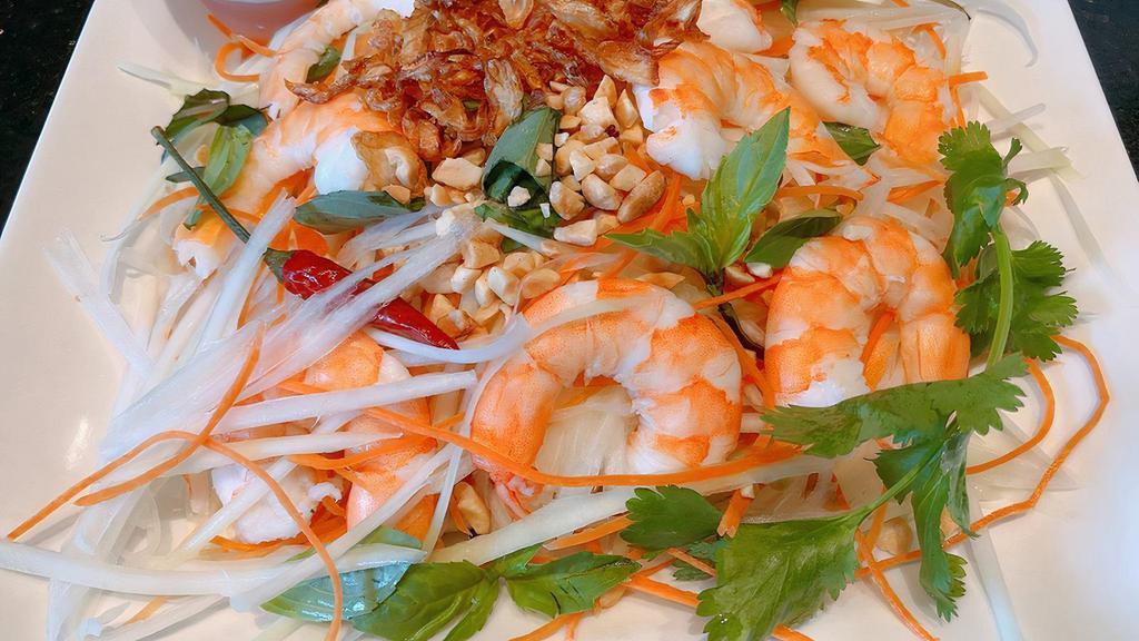 Green Papaya Salad · Vegetarian. Shredded green papaya with shrimp, carrots, & coriander, tossed in tany lime vinaigrette, topped with tossed peanuts & fried shallots.