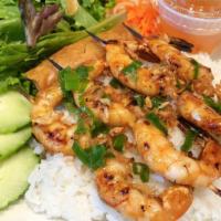 Grilled Shrimp Skewers · Gluten-free. Black tiger prawns topped with caramelized shallots.