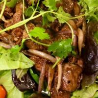 Beef Luc Lac · beef tenderloin marinated in rice wine, tossed in butter and yellow onions with mixed greens...