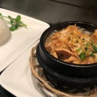 Ginger Chicken Clay Pot · Braised chicken in caramelized shallot soy sauce with fresh ginger, served with jasmine rice.