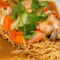 Seafood Bird'S Nest · Stir-fried tiger prawns, calamari, mushrooms and garden vegetables tossed in rice wine and o...