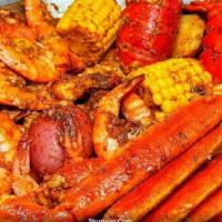 6 Combo · Shrimp without head, snow crab legs, two lobster tail, sausage, red potato egg and corn.