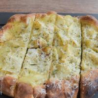 Yukon Gold Potato Pizza · Prosser farm potato, rosemary and pecorino romano.