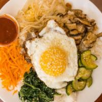 Bi-Bim-Bap · Served with white rice mushroom carrot zucchini spinach bean sprouts and choice of beef or c...