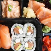 Salmon Lover Bento · Creamy salmon poke, 3 salmon sashimi, 2 salmon sushi, Philly roll, seaweed salad, pickled ra...