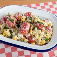 Corn And Tomato Salad - · Corn, Tomatoes, Basil, Red Onion and Cotija Cheese