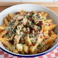 Poutine - · Crispy Chips, smothered in Clam Chowder, and topped with bacon, sharp cheddar, and chives.