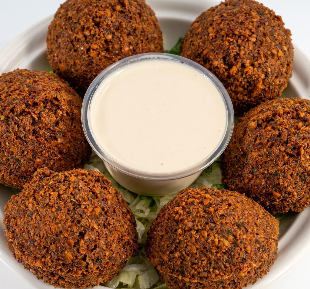 Falafel · Vegan, gluten free. Deep fried chickpeas onion and parsley mixed with spices.