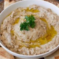 Baba Ghanoush · Vegan. Roasted mashed eggplant mixed with tahini sauce and our special blend of spices and s...