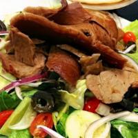 Salad Bowls Gyro · Gyro meat over our Greek salad with tortilla chip croutons & our special Dressing serve with...