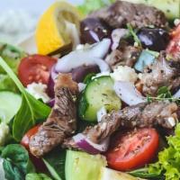 Salad Bowl Lamb · Lamb Shawarma meat over our Greek salad with tortilla chip croutons & our special Dressing s...