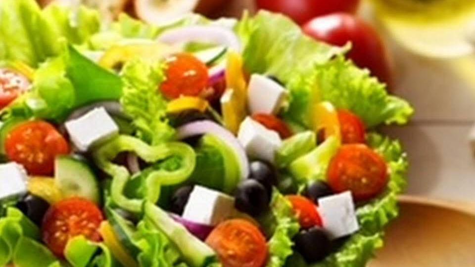Greek Salad · Blend of romaine lettuce, tomato, onion cucumber, and kalamata olives, with feta cheese and our house Greek dressing.